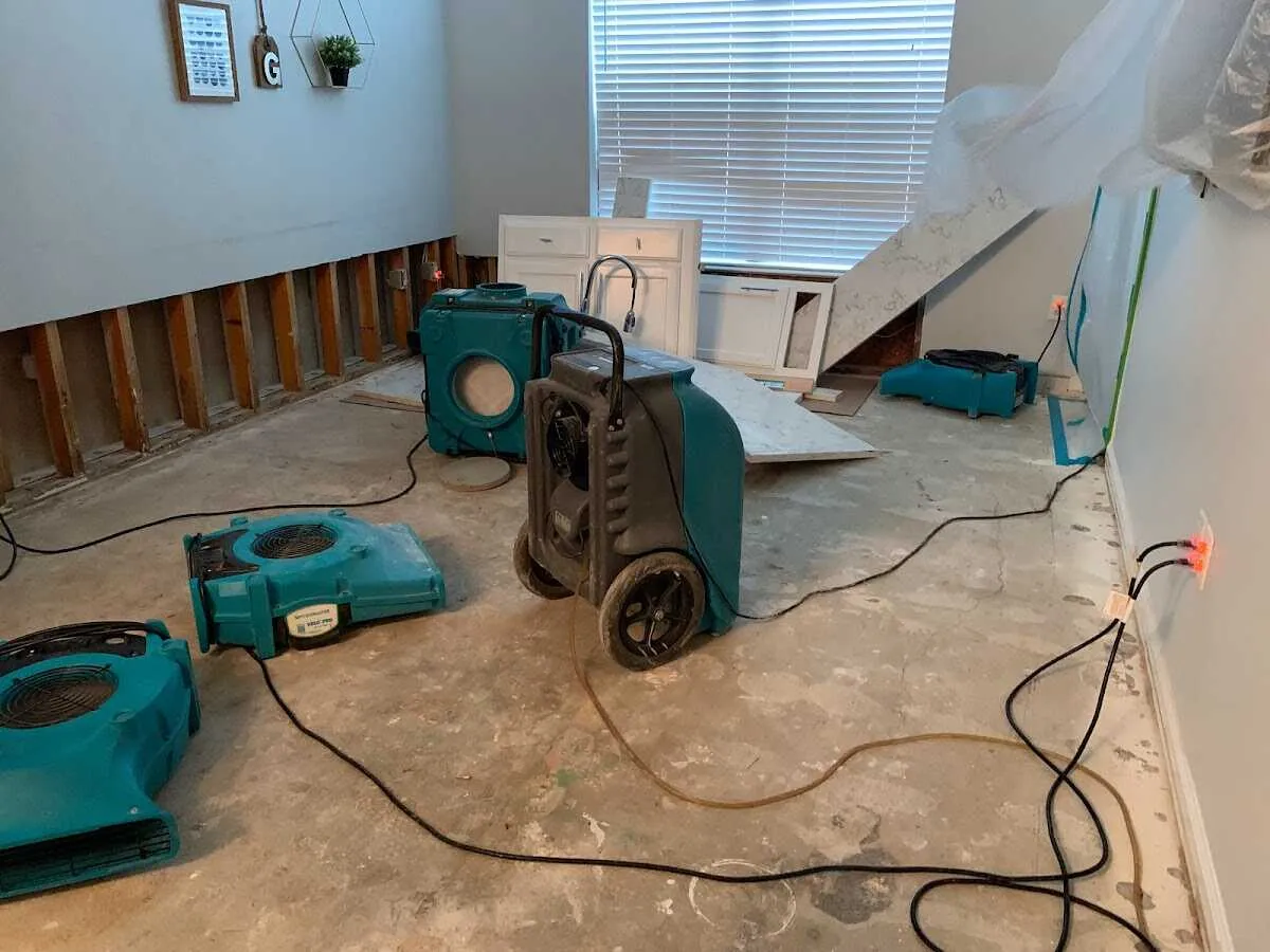 Dehumidifier in flood-cut room for Water Damage Restoration in Denton